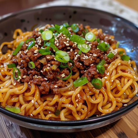 🍜🌶 Spice up your dinner with Mongolian Ground Beef Noodles, a quick, savory meal everyone will love! #MongolianBeef #NoodleNight 🍽️ Mongolian Ground Beef Noodles 🛒 Ingredients: 500 grams ground beef 400 grams noodles 1 onion, thinly sliced 4 cloves garlic, minced 50 ml soy sauce 30 ml hoisin sauce 15 ml vegetable oil 5 ml sesame oil Spring onions and sesame seeds for garnish 👩‍🍳 Instructions: Cook Noodles: Prepare noodles according to package instructions. Drain and set aside. Brown Beef:... Mongolian Ground Beef Noodles, Ground Beef Noodles, Mongolian Ground Beef, Beef Noodles, Instagram Recipes, Twisted Recipes, Food Trip, Spring Onions, Trending Recipes