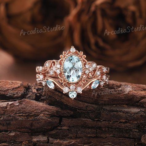 The design inspiration for this ring is akin to unfolding petals, capturing the delicate beauty of a blooming flower. The central gemstone represents the heart of the flower, while the intricate metalwork symbolizes the intertwining vines and leaves. The overall effect is one of timeless romance and natural elegance.🌿🌸 Unique Aquamarine Engagement Ring Set Floral Ring Rose Gold Ring Art Deco Leaf Ring Set Moissanite Ring Cluster Ring Promise Rings for Women If you want to see more pictures of Fairytale Engagement Rings, Fairytale Ring, Non Traditional Wedding Ring, Pretty Engagement Rings, Cute Engagement Rings, Ring Cluster, Floral Engagement Ring, Future Engagement Rings, Aquamarine Engagement Ring