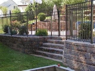 Wall With Fence On Top, Retaining Wall With Fence, Retaining Wall Fence, Block Retaining Wall, Craftsman Style Porch, Fence Screening, Types Of Fences, Retaining Walls, Yard Design