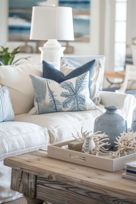 Beachy Vibes: Top Coastal Furniture Ideas for Home Tiny Coastal Living Room, Coffee Table Coastal Decor, Beachy Living Room Coffee Tables, Coastal Coffee Table Decor Ideas, Coastal Cottage Coffee Table, Coastal Hamptons Style Living Rooms, Beach Apartment Decor Coastal Style, Beach House Coffee Table Wood, Coastal Coffee Table Decor