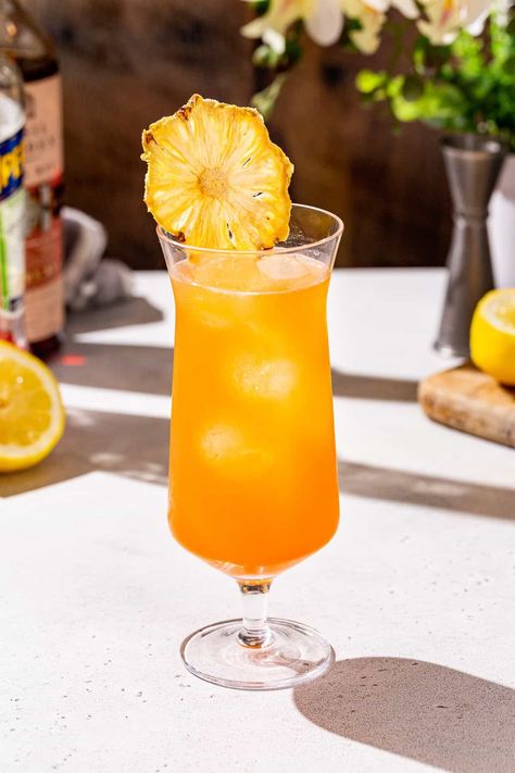 The Tropical Whiskey Punch is such a delicious summer cocktail! A mix of rye whiskey with pineapple, passion fruit and Aperol, it’s perfect on a hot summer day. It’s super easy to mix up and so tasty! This drink is great for anything from casual sipping on the patio to a tropical summer cocktail party! Whiskey Punch, Yummy Summer Cocktails, Summer Cocktail Party, Rye Whiskey, Tropical Drink, Easy Summer, Passion Fruit, Summer Cocktails, Cocktail Drinks