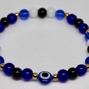 Blue evil eye bracelet with 6mm beads and gold spacer beads Blue Evil Eye Bracelet, Blue Evil Eye, Eye Bracelet, Evil Eye Bracelet, Spacer Beads, Evil Eye, Beaded Bracelets, Bracelet, Beads