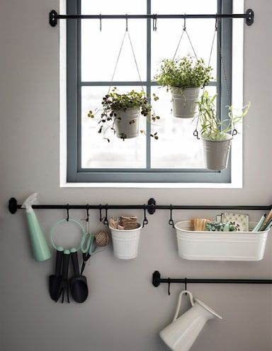 Bitten by the gardening bug? Set up a plant station with a mix of rails across and around a window. Here we used cutlery stands as pots. Play with different lengths and attach them using string. Store your tools in condiment stands fastened with hooks. Fintorp Ikea, Window Plants, Bar Storage, Ideas Para Organizar, Bathroom Windows, Kitchen Window, Organizing Your Home, Apartment Therapy, Towel Bar