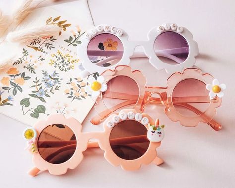 Wedding days are special, and so does people who are involved in your special day and among them, your little flower girl is the precious one. Show a sweet gesture for your little flower girl. Gift them our personalized flower-shaped sunglasses and make them look lovely and eye-catching in the crowd. These flower-shaped sunglasses are perfect flower girl gifts for your bridal party. Even you can make it a perfect flower girl proposal for your wedding. Sienna Wedding, Bridal Party Sunglasses, Wedding Features, Girl Sunglasses, Flower Girl Proposal, Flower Sunglasses, Custom Baby Gifts, Shaped Sunglasses