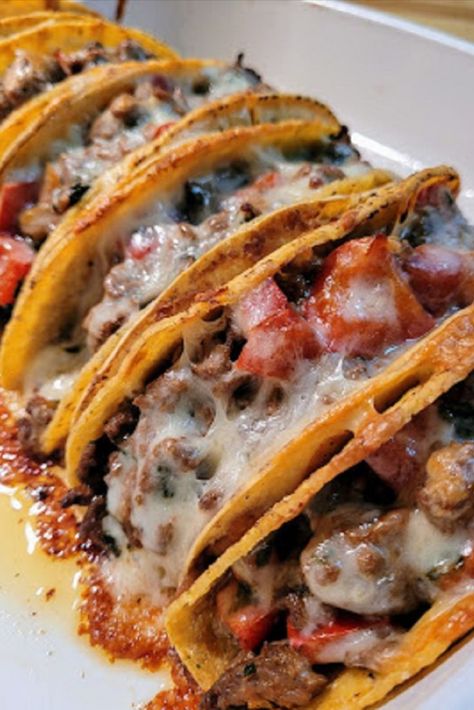 tacos stacked side to side in a baking dish with melted cheese on top Double Decker Tacos, Oven Baked Tacos, Baked Tacos, Tacos Recipes, Food Recipes Easy, Running Mom, Taco Bake, Rice And Peas, Homemade Tacos