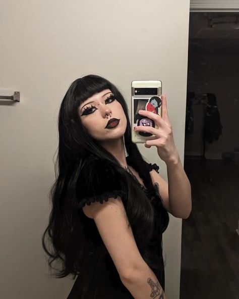 🦋 whitney 🦇 on Instagram: "the middle of adventure is such a perfect place to start 🥀 ××× @uniwigs discount code: whitney20 🖤 #uniwigs ××× ××× ××× ××× #hair #blackhair #wig #lacefrontwigs #alt #alternative #altstyle #emo #outfitoftheday #gothicaesthetic #gothic #gothgirl #darkaesthetic #style #fashion #altgirl #grungeaesthetic #ootd #goth #gothaesthetic #gothmakeup #darkmakeup #piercings #tattooedgirls #makeup #beauty #cosmetics #eyemakeup #tattoos" Curly Wig With Bangs, Afro Punk Fashion, Goth Hair, Dark Witch, Curly Hair Styles Easy, Goth Beauty, Goth Makeup, Creative Makeup Looks, Curly Hair With Bangs