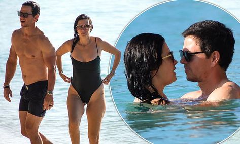 Mark Wahlberg, 51, packs on the PDA with wife Rhea Durham, 44, for a swim in Barbados | Daily Mail Online Rhea Durham, Muscular Physique, Long Brunette, Mark Wahlberg, In The Ocean, Beach Look, Guys Be Like, Black Swimsuit, Barbados