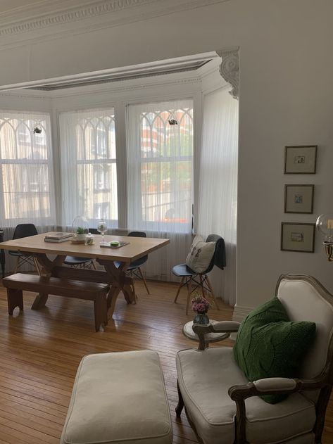 Dining table in front of large windows Apartment Kitchenette, Table In Front Of Window, Mini Kitchenette, City Studio Apartment, Window Table, Apartment Hunting, Single Mattress, Countryside House, Quebec City