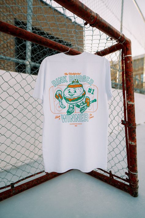 Have a winner for dinner. The undefeated rink burger is a well-known champion across the globe, found at your local rink’s concession stand. Now also available on tees, sweaters, and slider sizes (kids apparel) at Hardpressed.⁠ ⁠ A portion of all Rink Burger sales will be donated to Kids Sport Saskatchewan. #hockey #rinkburger #graphictee #odr #whitetee Burger Graphic, Home Snow, Arctic Blue, Concession Stand, Boxy Tee, Love To Meet, Content Ideas, Kids Sale, Kids Sports