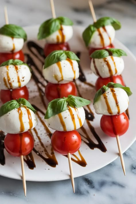 A photo of a  Caprese Skewers a New Years Snacks Cute Easy Party Snacks, New Years Appetizers Easy Kids, New Year Food Decoration, New Year’s Eve Party Inspiration, Christmas Cocktail Party Food Appetizers, New Year’s Eve Canapés, Nye Fruit Platter, Crockpot Nye Recipes, Nye Orderves