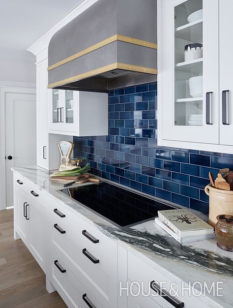 An indigo subway tile backsplash feels British and historical, and picks up on the deep veining in the Calacatta marble countertops. | Photographer: Janet Kimber | Designer: Colin Blanchard and Kenneth McRobbie Blue Backsplash Kitchen, Kitchen Remodel Countertops, Blue Backsplash, Kitchen Tiles Design, Black Appliances, Kitchen Backsplash Designs, Blue Tile, Subway Tiles, Kitchen Remodeling Projects