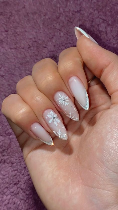 Festive White Nails, Snowflake Nails With Rhinestones, Christmas French Tip Nails Snowflakes, Snowflake Stiletto Nails, Almond Nails Snowflakes, Snow Queen Nails, Snow Themed Nails, Ice Princess Nails, Icicle Nails Acrylic