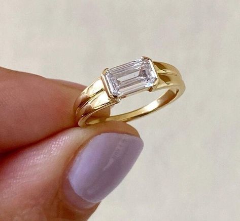 East To West Emerald Cut Moissanite Engagement Ring, Solitaire Half Bezel Double Row Band Ring, Daily Wear Ring, Gift For Her, 14K Gold Ring Item Description: Stone - Moissanite & Simulated Diamond Shape-  Emerald Cut  1. White Gold: 10K/14K/18K 2. Yellow Gold: 10K/14K/18K 3. Rose Gold: 10K/14K/18K 4. Silver: Sterling Silver 925 Size Customization: What Size you want... * You can also Customize ring size in US 4 to US 12! It sometimes affects to price. * Main Stone & Shape Customization: Main Stone: Cubic Zirconia, Moissanite, Natural Diamond, CVD Diamond Shape Choice: Round Cut, Heart, Princess Cut, Pear Cut, Cushion Cut, Marquise, Oval Shape, Asscher, Emerald, Radiant, Old European Cut, Old Mine Cut * Check out Special Notes: At checkout, leave us a note in the message box for the Ring s Double Band East West Ring, Horizontal Ring Engagement, Sideways Rectangle Engagement Ring, Sideways Emerald Engagement Ring, East West Emerald Engagement Ring, Flat Engagement Ring, East West Engagement Ring, Half Bezel Engagement Ring, Ring Daily Wear