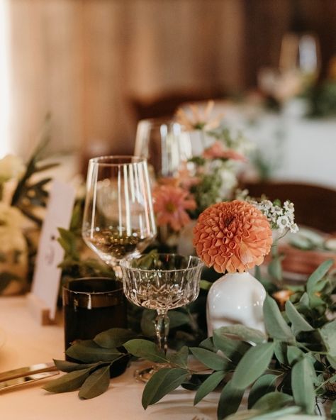 We love a dramatic fall centerpiece. For Erica and Nate’s wedding we wanted to pair traditional fall colors with the wild and organic greenery runner. We added in crystal glassware to give the table decor an elevated and luxurious feel and paired with a organic heavy weight napkin in orange spice to real seal those fall vibes! Rentals: @encoreeventsrentals Venue: @straushomeranch Photographer: @lizkoston Flowers and Design: @threesummerdaysevents Greenery Runner, Glass Hurrican Centerpieces Fall, Orange Spice, Crystal Glassware, Modern Couple, Fall Centerpiece, Event Management, Timeless Wedding, Fall Vibes