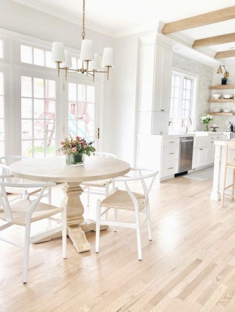 Round Coastal Dining Table, Neutral Guest Bedroom, Coastal Dining Table, Red Oak Hardwood Floors, Florida Kitchen, White Wood Kitchens, Coastal Dining, Kitchen Counter Stools, Entryway Console Table