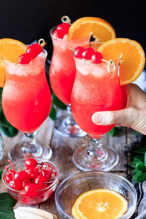 Hurricane Mocktail: an easy recipe to make for a crowd in a pitcher. Learn how to make this popular Mardis Gras drink for parties the classic way, and also as a frozen slushie. It's simple, fun, fruity, and refreshing. | savortheflavour.com #savortheflavour #hurricanedrink #mardigras Mardi Gras Drinks, Peach Daiquiri, Passion Fruit Syrup, Passion Fruit Juice, Lemon-lime Soda, Tropical Drink, Mardi Gras Party, Mocktail Recipe, Pomegranate Juice