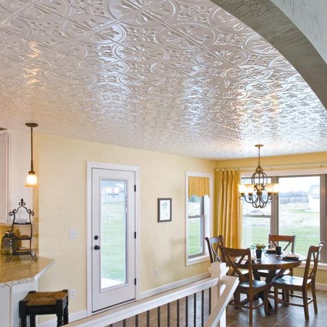 Alternative to drop ceilings by Fasade. System attaches to floor joists and only adds an inch compared to the 7" of suspended ceilings...brilliant! White Tin Ceiling Tiles, White Tin Ceiling, Stamped Tin Ceiling, Coffer Ceiling, Tiles Diy, Faux Tin Ceiling, Drop Ceiling Tiles, Faux Tin Ceiling Tiles, Backsplash Wall