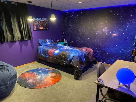 My preteen son outer space bedroom! Wall art, bed spread, rug, led lights and moon lamp all off amazon. Outerspace, universe bedroom, dark purple bedroom, preteen bedroom, boys bedroom, epic bedroom! Galaxy Bedroom Wall, Galaxy Office Decor, Galaxy Walls Bedroom, Galaxy Wall Bedroom Ideas, Galaxy Room Painting Ideas, Universe Room Ideas Bedrooms, Boys Purple Room, Outer Space Room Ideas, Galaxy Painted Wall