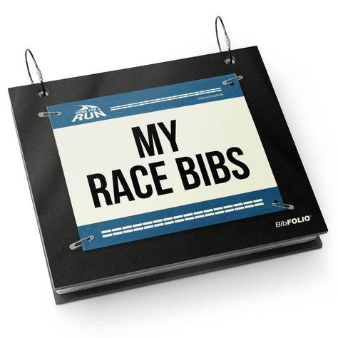 PRICES MAY VARY. THE ORIGINAL BIBFOLIO RACE BIB ALBUM protects and beautifully displays your collection of race bibs from marathons, half-marathons, 5Ks, triathlons, road races, and other athletic events. Makes for the perfect gift for a runner to keep on display at home or in the office! DISPLAY YOUR RACE BIBS WITH PRIDE! Easily add and organize your race bibs by opening the rubberized round binder rings and sliding your bib thru the pre-existing holes. You can further protect and display your Race Bib Holder, Running Bibs, Black Bookshelf, Race Bibs, Running Gift, Binder Rings, Running Race, Running Gifts, Medal Display