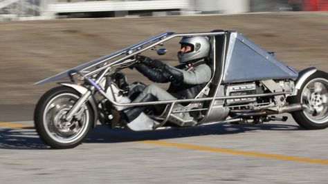 The Exodus recumbent motorcycle, by U.S. company Suprine, is a 130-horsepower, lay-back motorbike with a roll cage and a perspex windscreen, capable of more than 80 miles per gallon on the highway. Recumbent Motorcycle, Bmw Bike, Three Wheeled Car, Racing Harness, Scooter Custom, Мотоциклы Cafe Racers, Reverse Trike, Motorbike Design, Futuristic Motorcycle