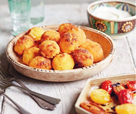 Oven-Baked Cheese Polenta Balls (Bulz) With Yogurt and Roasted Tomatoes Polenta Balls, Cheese Polenta, Romanian Recipes, Hot Snacks, Roasted Cherry, Roasted Cherry Tomatoes, Baked Cheese, Romanian Food, Cheese Ball