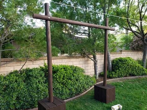 I built my daughter a custom wedding arch for her outdoor wedding. Being on a budget shouldn't stop you from building a custom arch that is affordable. This arch used three (3) round posts that were 3 inch wide by 8 feet long. I used concrete in buckets for the base in case high winds came up. Below I will detail how it was built hoping to give you some ideas of what you can make for your loved ones future wedding. For the base, I took two 5 gallon buckets and placed the 4 inch ABS… Wedding Arch Ideas Indoor, Wedding Arch Ideas Outdoor, Indoor Wedding Arch, Wedding Arch Ideas Diy, Kitschy Wedding, Cedar Wood Fence, Wedding Arch Ideas, Diy Wedding Arch, 5 Gallon Buckets