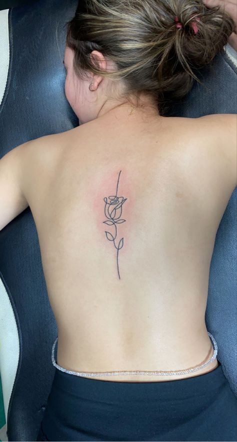 Single line rose spine tattoo Back Tattoo Women Rose, Back Tattoo Rose, Back Rose Tattoo, One Line Rose Tattoo, Rose Tattoo Back, Rose Back Tattoo, Line Rose Tattoo, Rose Tattoo On Back, Beautiful Back Tattoos