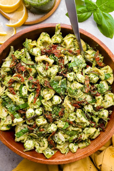 An easy & delicious pesto tortellini pasta salad! Pillowy soft cheese tortellini are tossed with sun-dried tomatoes, artichokes, fresh mozzarella & parmesan then coated in mouth-watering pesto! Perfect for summer parties, potlucks or serve as a light dinner! Pesto Tortellini Pasta Salad, Kalefornia Kravings, Tortellini Pasta Salad Recipes, Tortellini Pasta Salad, Antipasto Pasta Salads, Italian Antipasto, Pesto Cheese, Pesto Tortellini, Pasta Salad With Tortellini