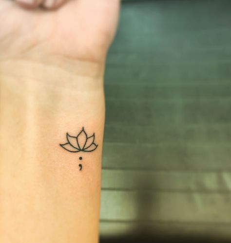 Tattoo Ideas Meaning For Mom, Small Tattoos Simple Semi Colon, Lotus Aesthetic Tattoo, Semi-colon Tattoo Lotus, Lotus Flower Tattoo Semi Colon, Mini Tattoos Semi Colon, Lotus Flower Tattoo With Semi Colon, Lotus Flower And Semicolon Tattoo, Lotus And Semicolon Tattoo