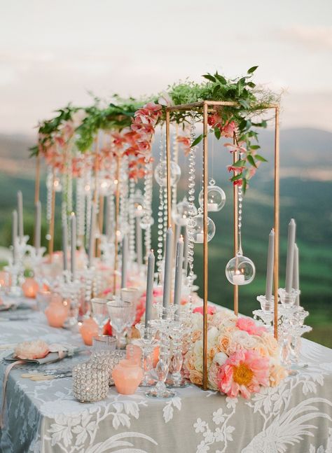 If you find yourself daily dreaming of rom-coms in Italy, then this lavish peach wedding inspiration in the heart of Siena just might stop you in your tracks. With a Tuscan hill view and floating candles along the tablescape, this European vineyard fete is easily a chart topper! #ruffledblog Colorful Summer Wedding Decor, Cats Wedding, Greg Finck, Floral Stand, Tall Centerpiece, Candles Flowers, Cyprus Wedding, Tall Wedding Centerpieces, Tafel Decor