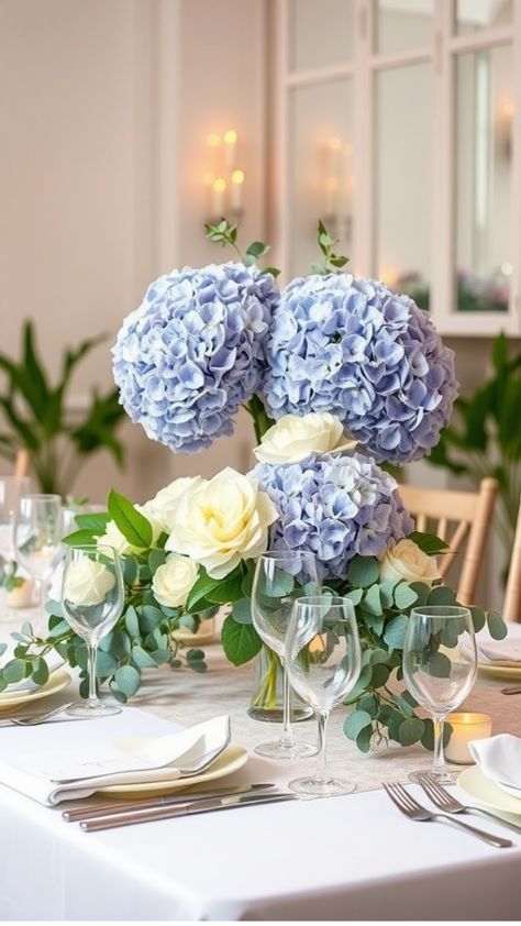 Elegant table setting with blue hydrangeas, white roses, and greenery centerpiece. Pink Hydrangea Centerpieces, Hydrangea Boutonniere, White Hydrangea Bouquet, White Hydrangea Wedding, Hydrangea Bouquets, Blue Hydrangea Bouquet, Eucalyptus Wedding Decor, Hydrangea Bridal Bouquet, Hydrangea Bouquet Wedding