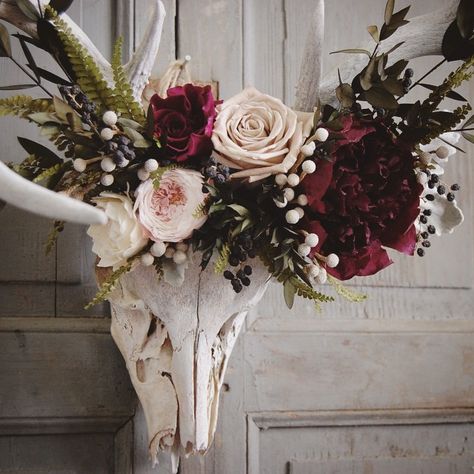 Close up of the preserved floral crown made for this deer skull, which was found in west Texas. Shades of deep raspberry, cream, cappuccino, green, and silvery blue. Preserved flowers last for years with very little maintenance. Something unique for your wall and a lovely way to honor this beautiful animal. Steampunk Bedroom, Film Decor, Decoration Vitrine, Raspberry Cream, Antler Art, Deer Skull, Entryway Living Room, Deer Skulls, Home Remodel