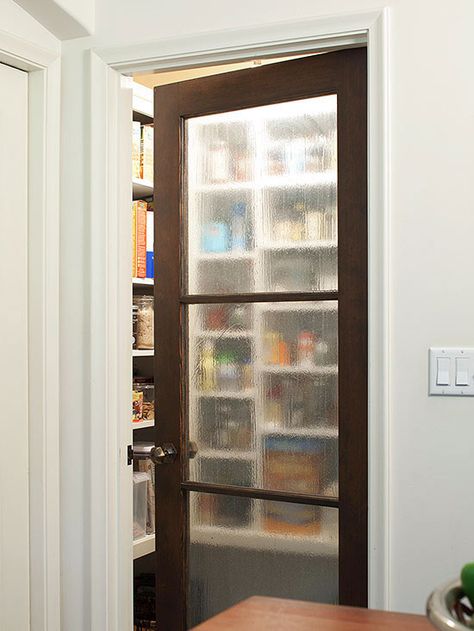 Keep everything within grabbing distance with these walk-in and reach-in pantry ideas. Food storage remains hidden so it doesn't clutter up the style of your kitchen, but, when you need to access contents, deep shelves and on-the-door storage makes finding and organizing items easy. Proper lighting and labeling keep items tidy and easy to spot! Small Pantry Door, How To Install A Pocket Door, Frosted Glass Pantry Door, Walk In Pantry Ideas, Pantry Door Ideas, Pantry Redo, Glass Pantry Door, Glass Pantry, Pantry Room