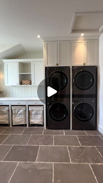 Pro Kitchen Design on Instagram: "This laundry room features two washer and dryer units, three pull-out drying racks, and a total of six pull-out laundry bins for easy sorting. Above the countertops, there’s plenty of storage and a hanging bar to keep items wrinkle-free right out of the dryer. This space truly embodies functionality and elegance of a dream laundry room!" Laundry Bins, Dream Laundry Room, Laundry Bin, Drying Racks, Hanging Bar, Drying Rack, Washer And Dryer, Wrinkle Free, Laundry Room