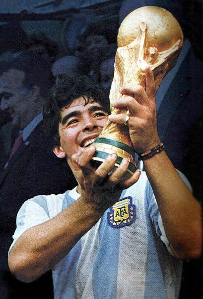 Diego Maradona held the FIFA World Cup trophy after winning the final against  Germany. Jules Rimet Trophy, Maradona Football, World Cup Trophy, Birthday Party Games For Kids, Retro Pictures, World Cup Winners, Free Kick, Professional Football, Action Poses