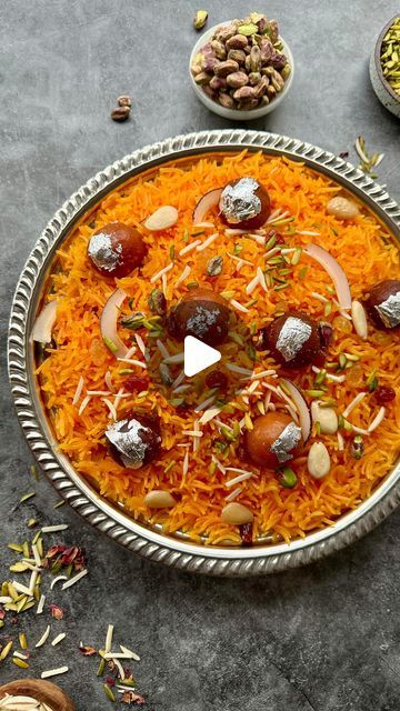 Zubda Malik on Instagram: "Zarda (Sweet Rice Eid Ul Adha Special) 

Ingredients:
- 4 cups sella rice
- 2 tsp yellow/orange food color
- 2 star anise
- 5 cloves
- 4 green cardamoms
- 2 lemon slices
- 1/2 inch cinnamon stick
- 2 bay leaves
- 1/2 cup butter or ghee
- 1 cup milk
- 4 cups fine granulated sugar
- 1/4 cup raisins
- 1/4 cup peeled almonds
- 1/4 cup pistachios or cashews
- 1/4 cup coconut slices
- 5-6 mini gulab jamun for garnish
- Edible silver leaf

Instructions:

1. Wash the rice with cold water, changing the water 3-4 times until it runs almost clear. Allow the rice to soak for 2-3 hours, then drain the water.

2. Boil water in a large wide cooking vessel and add lemon slices, green cardamom, cloves, star anise, cinnamon stick, and bay leaves.

3. Once the water boils, add the Eid Recipes, Orange Food, Coconut Slice, Green Cardamom, Eid Food, Orange Food Coloring, Sweet Rice, Naan Recipe, Gulab Jamun