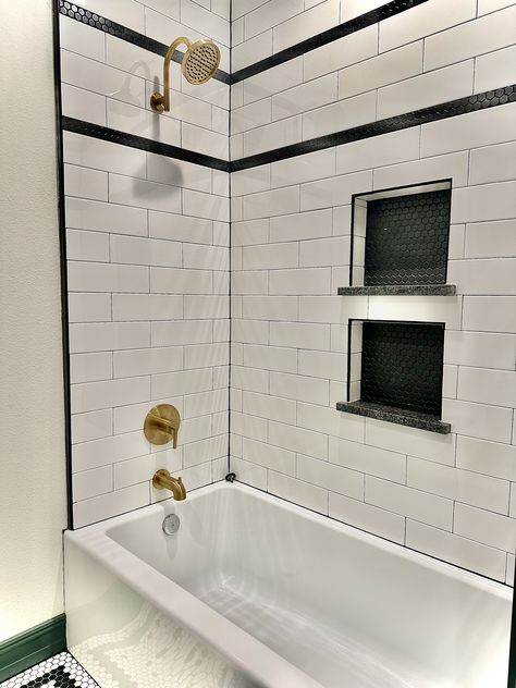 Subway Tile Bathroom Black Grout, White And Black Subway Tile Bathroom, Black And White Tile Tub Surround, Shower Tile Black And White, Black Schluter Tile Edge Showers, Black And White Subway Tile Bathroom, Subway Tile Shower With Accent, Shower White Subway Tile, Adu Interior