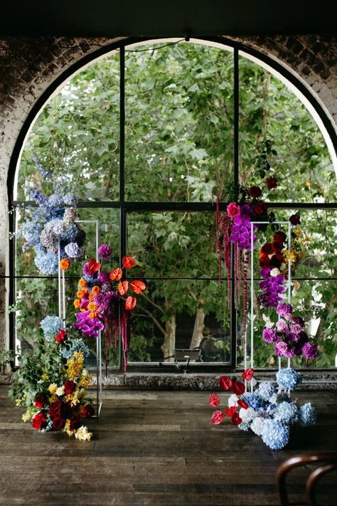 Vibrant Wedding Ceremony, Color Block Floral Installation, Colorful Petals Wedding Aisle, Color Block Floral Arrangement, Pink Floral Installation, Wedding Flower Display, Unique Event Decor, Bright Wedding Colors, Colourful Wedding