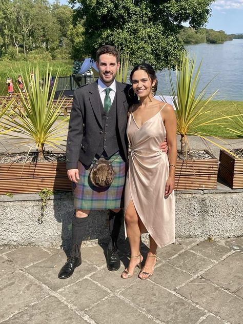 Champagne silk wedding guest dress and kilt green tarton. Couple at scottish wedding. #scottishwedding #kilt #greentarton #champagnesilkdress #weddingguestdress #weddingoutfit #scottishweddingdress Scottish Wedding Attire, Silk Wedding Guest Dress, Champagne Silk Dress, Wedding Guest Attire, Guest Attire, Scottish Wedding, Wedding Attire Guest, Silk Wedding, Guest Dress