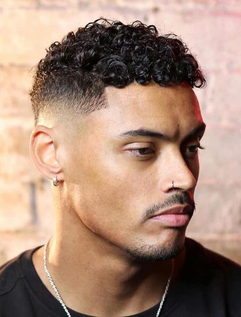 Perfect Mid Fade with Sharp Line Up - If you’re after a mid fade that’s great for curly hair, look no further. This style allows the hair’s curly nature to shine through and uses the mid fade to add tidiness. Haircuts Fir Natural Curly Hair Men, Men’s Curly Haircut Black, Mixed Hair Men Haircut, Skin Fade Haircut Men Curly, Mid Fade Haircut Curly Hair, Men Curly Hairstyles Black, Mid Fade With Curly Hair, Dominican Hairstyles Men, Curly Fade Haircut Men Black