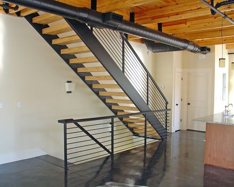 As you enter into the apartment space you'll immediately notice the loft styling with exposed ceiling beams and duct work along with open stair case and railing. Open Stair Case, Exposed Ductwork, Exposed Ceiling Beams, Cypress House, Exposed Ceiling, Rustic Barn Decor, Brick Living Room, Hvac Design, Exposed Ceilings