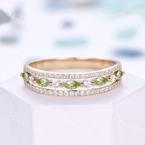 Vintage Peridot Moissanite Engagement Ring,Marquise Peridot Wedding Band,Gold Ring,Handcraft Three Row Anniversary Promise Ring Gift For her,August birthstone ring This is a very unique 14k gold wedding band. It can be made in solid 14k white gold,yellow gold,rose gold. The bottom band width is about 2.5mm, For this one, there are 3 different stones choice: 1,Natural Peridot +Simulated Diamonds. VVS-F 2,Natural Peridot +Natural Real Diamonds.SI Clarity and H Color. 3,Natural Peridot+Moissanite. Peridot Wedding Band, Wedding Band Gold, Engagement Ring Marquise, Peridot Engagement Rings, August Birthstone Ring, 14k Gold Wedding Band, Ring Marquise, Promise Ring Gift, Engagement Rings Marquise