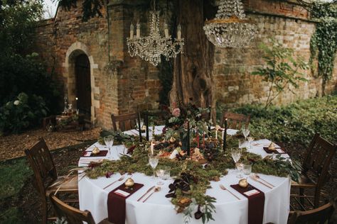 A Secret Garden Banquet Mossy Table Decor, Witchy Wedding Table Setting, Wedding Decor Round Table Ideas, Whimsical Wedding Round Table, Moss Tablescape Wedding, Moss Table Centerpiece, Enchanted Forest Wedding Table Decor, Circle Table Settings Wedding, Moss Table Setting