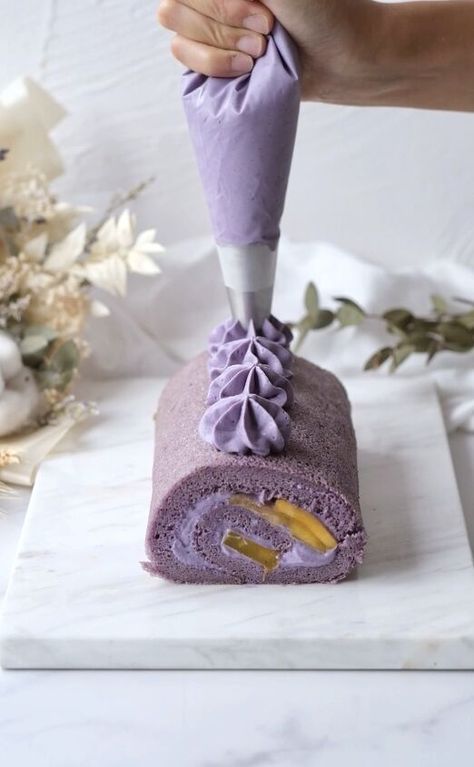 This is a recipe for a super fluffy ube and mango roll cake. The cake sponge is chiffon, so it is very soft. Ube, also known as purple yam, has a slight nutty and sweet flavour. It adds a beautiful and vibrant purple colour to bakes and desserts.I love the contrast of the flavours and colours of the ube and mango. The ube flavour of the fresh cream is also subtle and not too sweet. Roll cakes are one of my favourite types of cakes to make because I love the ratio of cream to cake spong… Ube Roll, Ube Dessert, Cake Sponge, Roll Cakes, Cakes To Make, Swiss Roll Cake, Purple Yam, Roll Recipes, Creme Egg