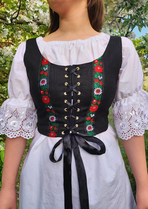 Linen folk vest with traditional folk ribbon inspired by Slavic folklore style.🌻 Material 100% Linen Tie Detail: Each color option comes with a black satin ribbon for tying Designed and made with love in Slovakia.  Size options: XS,S,M,L,XL,XXL Ready to ship within 5 business days ♥️ Hungarian Folk Dress, Balkan Traditional Clothes, Folk Style Clothing, Cottagecore Vest, Folklore Outfit, Finnish Clothing, Folk Vest, Folklore Style, Romanian Clothing