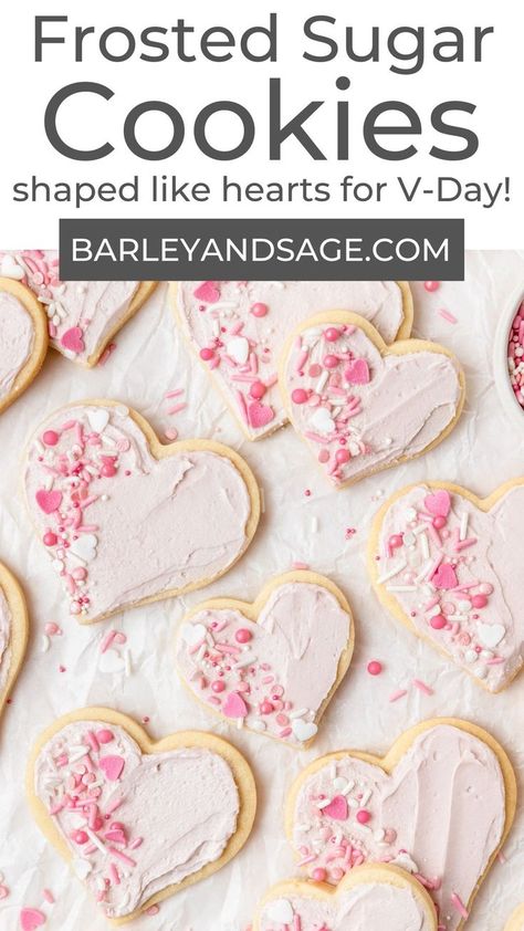 These heart shaped frosted sugar cookies are decorated with pink buttercream frosting and heart themed sprinkles for an easy Valentine's day dessert! These cookies are similar to the iconic Lofthouse style cookies with a soft, melt-in-your-mouth texture and sweet vanilla frosting!