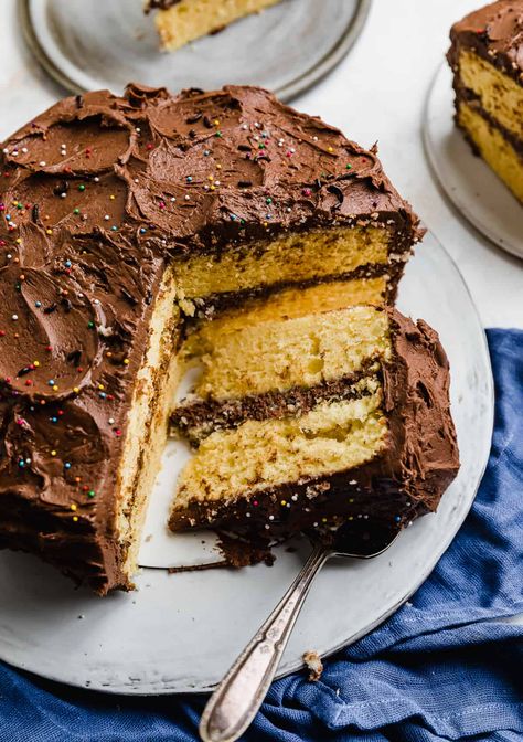 Looking for the BEST yellow cake with chocolate frosting recipe? Look no further! Whipped egg whites and buttermilk create the perfect texture in this delicious cake, while extra egg yolks add color and richness. Paired with chocolate buttercream frosting, it's a match made in heaven. Extra Egg Yolks, Yellow Cake Chocolate Frosting, Yellow Layer Cake, Yellow Cake With Chocolate Frosting, Chocolate Frosting Recipe, Cake With Chocolate Frosting, Moist Yellow Cakes, Dark Chocolate Recipes, Yellow Cake Recipe