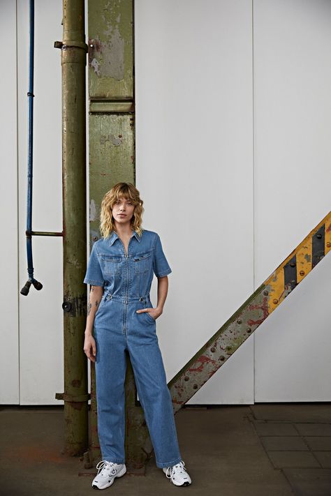 Experience timeless 1970s style with our denim overalls. The loose fit, zip-through placket, and slanted yoke exude retro vibes. Button-down chest pockets and ankle hems add extra charm to these indigo denim overalls. Crafted with stretch for comfort and a beautiful drape, they feature a super dark finish that recalls 1990s edge. Embrace the boot cut and low rise design for a fashionable statement. Step into these iconic overalls and rock the perfect blend of comfort and style! 1970s Style, Super Dark, Bleached Denim, Embrace It, Jean Overalls, Indigo Denim, 1970s Fashion, Beautiful Drapes, Lee Jeans