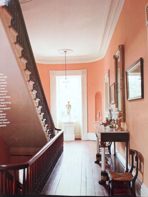 Peach walls and elegant staircase Peach Walls, American House, Entry Hall, Entry Way, Living Room Paint, Room Paint, Room Colors, Wall Colors, Colorful Interiors