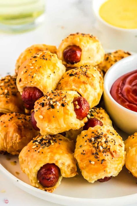 Pigs in a Blanket are a classic appetizer that is perfect for any occasion! Usually made with crescent roll dough, these are lighter and flakier with puff pastry. Seasoned perfectly with the wildly popular everything bagel seasoning, the pack a punch in a small bite. Fun and delicious for the whole family! Kids Approved! #pigsinablanket #appetizerrecipe #puffpastry #puffpastryappetizer Puff Pastry Little Smokies, Mini Pig In A Blanket, Puff Pastry Pigs In A Blanket Recipe, Puff Pastry Sausage Bites, Pigs In A Blanket Puff Pastry, Pigs In A Blanket Recipe Puff Pastry, Puff Pastry Pigs In A Blanket, Nachos Supreme Recipe, Church Desserts